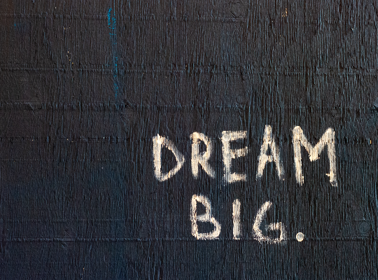 "Dream big" text on black background